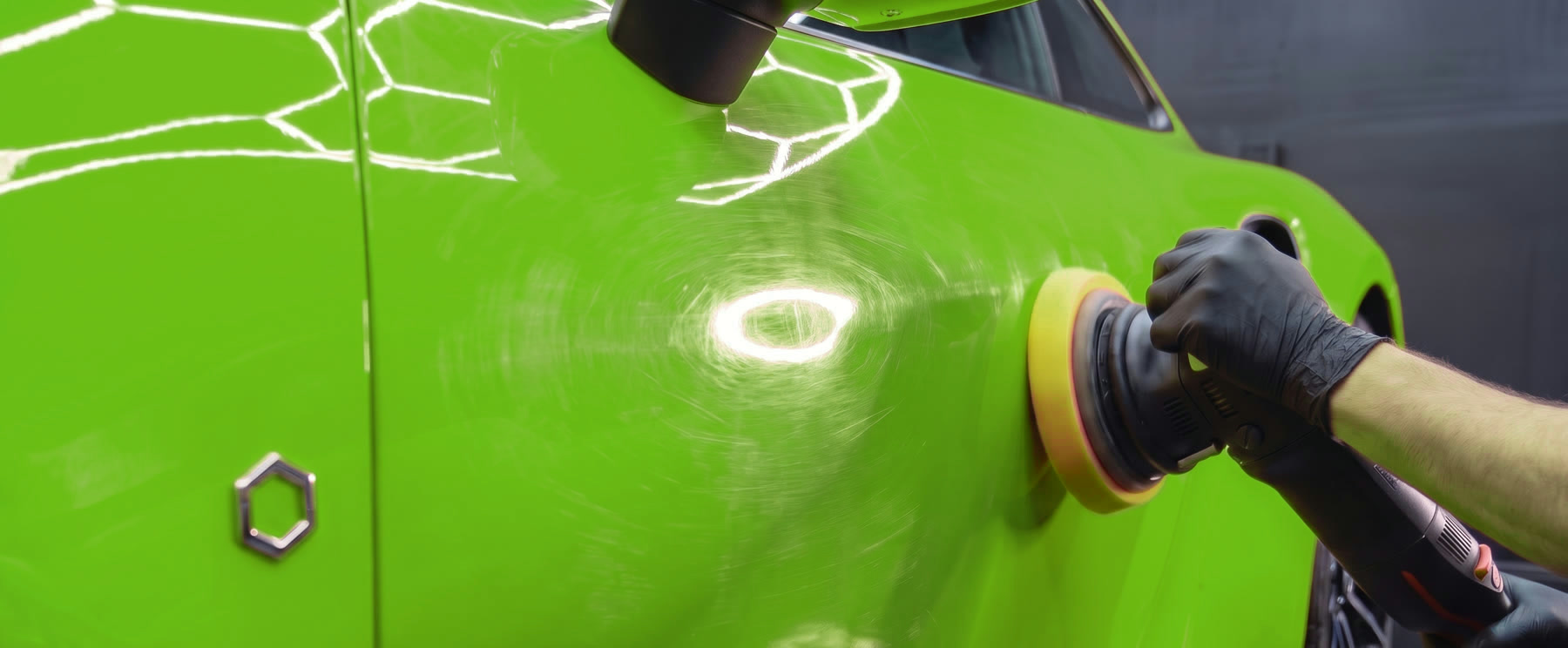 Door before paint correction, covered in swirl marks